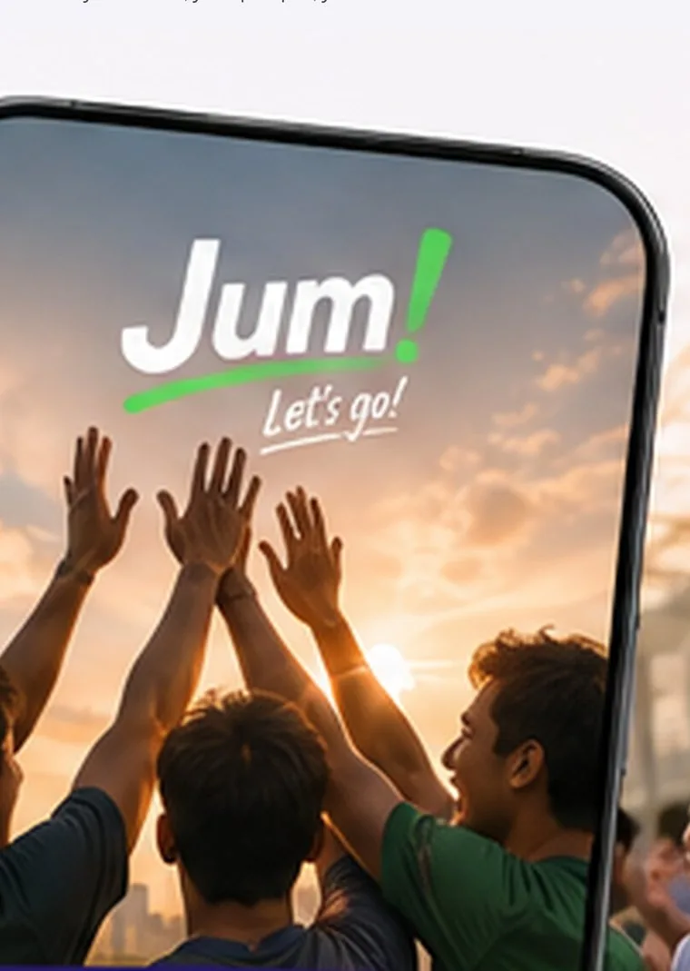 A group of friends high-fiving together outdoors at sunset, seen through a phone displaying the Jum app